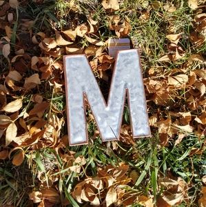"M" sign.
